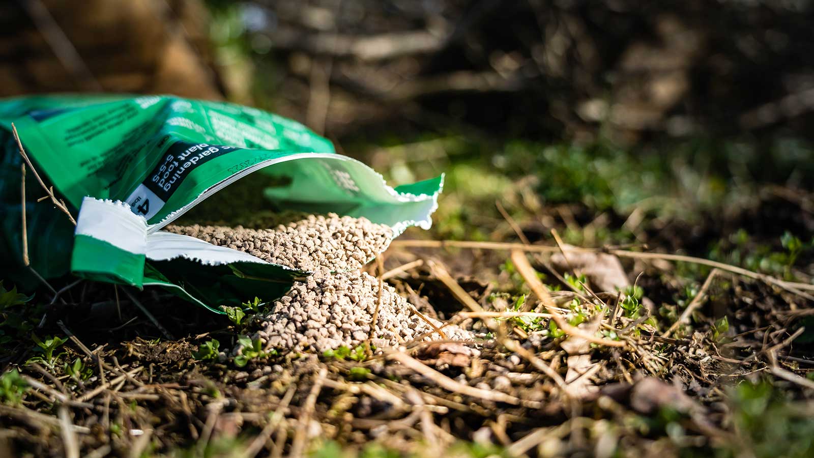 Traditional chemical fertilizers harming soil and plant health.