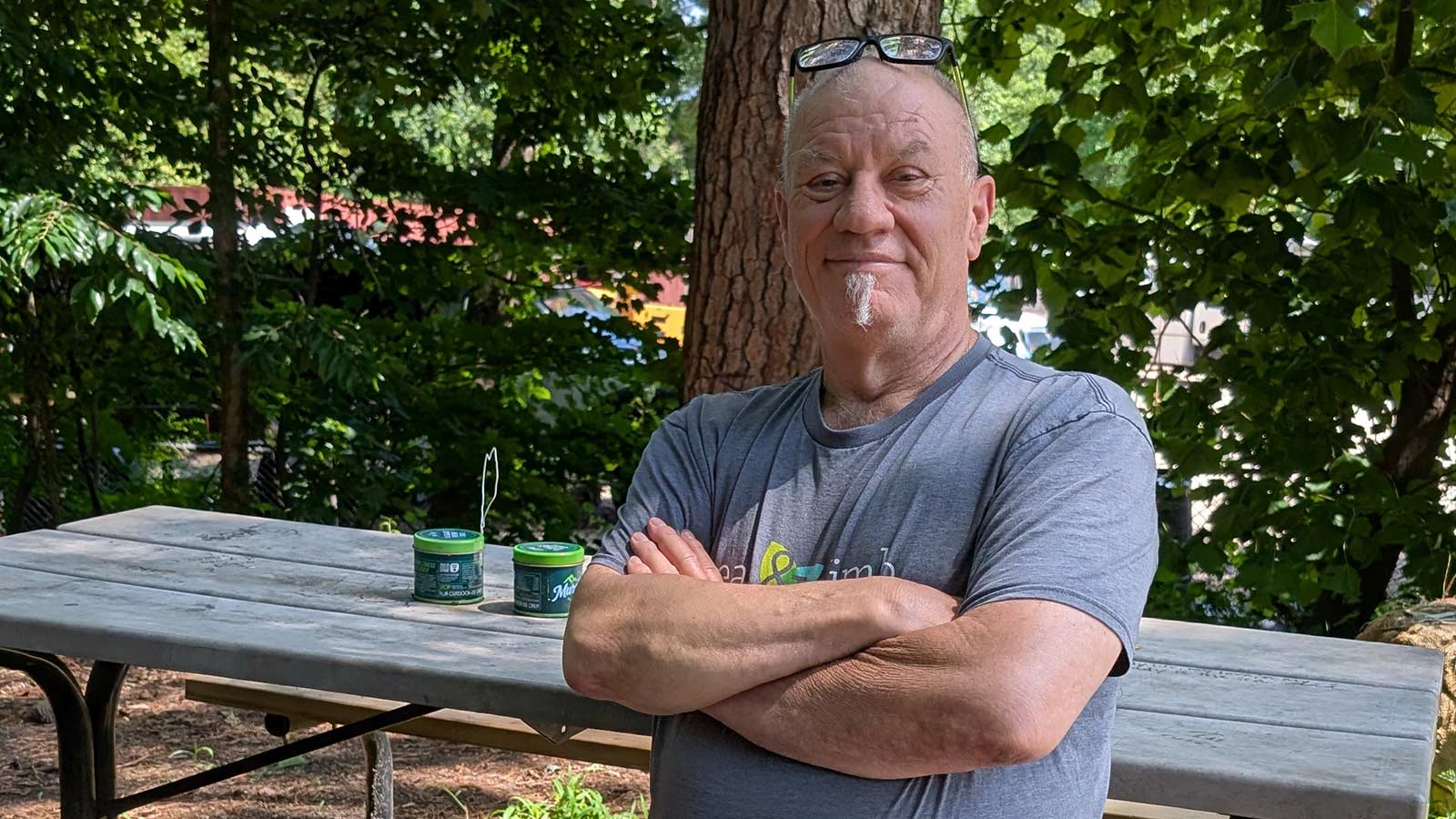 Colin, Leaf & Limb owner sitting at a picnic table and smiling.